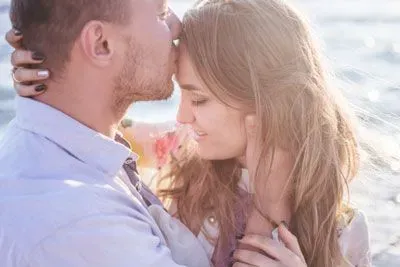 happy Christian couple embracing outside