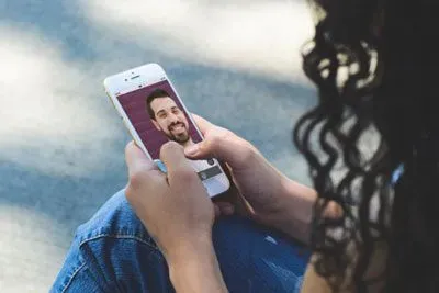 Woman using League Live video dating to talk to a match